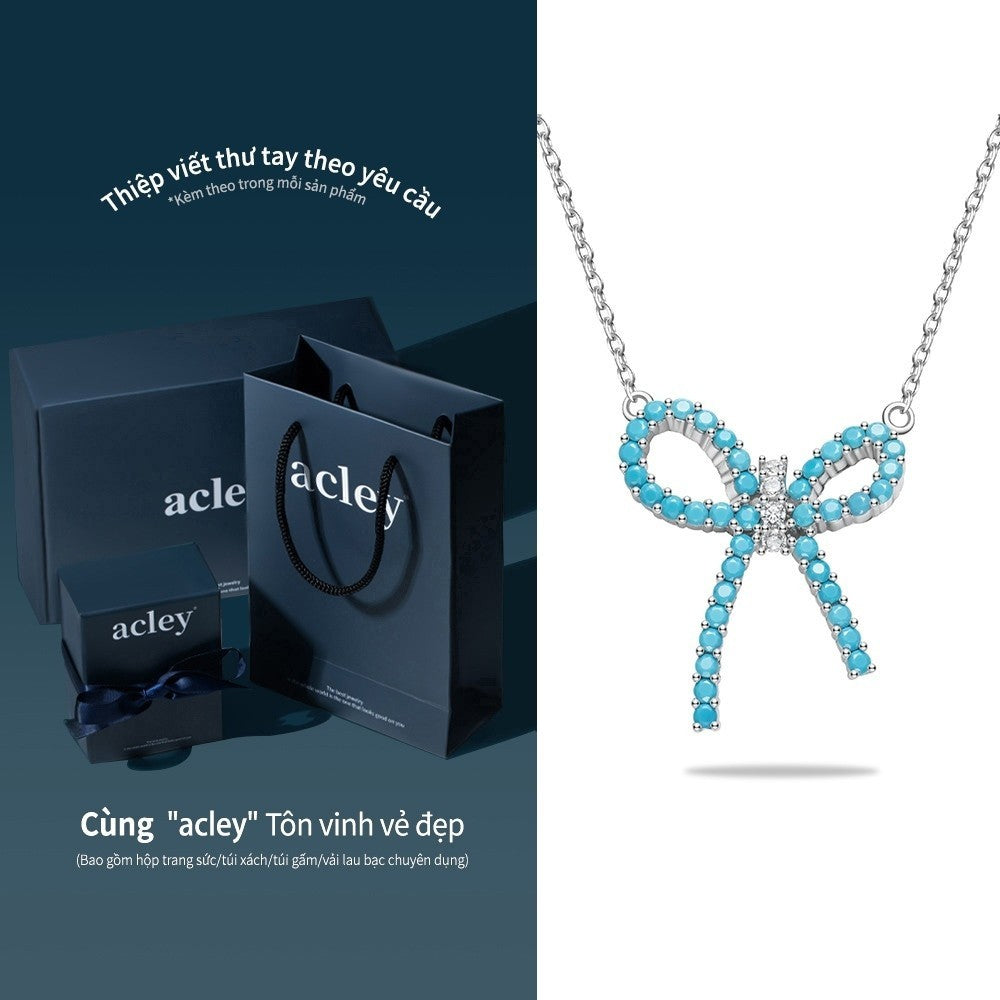 Dây chuyền nơ bạc S925 khảm đá turquoise