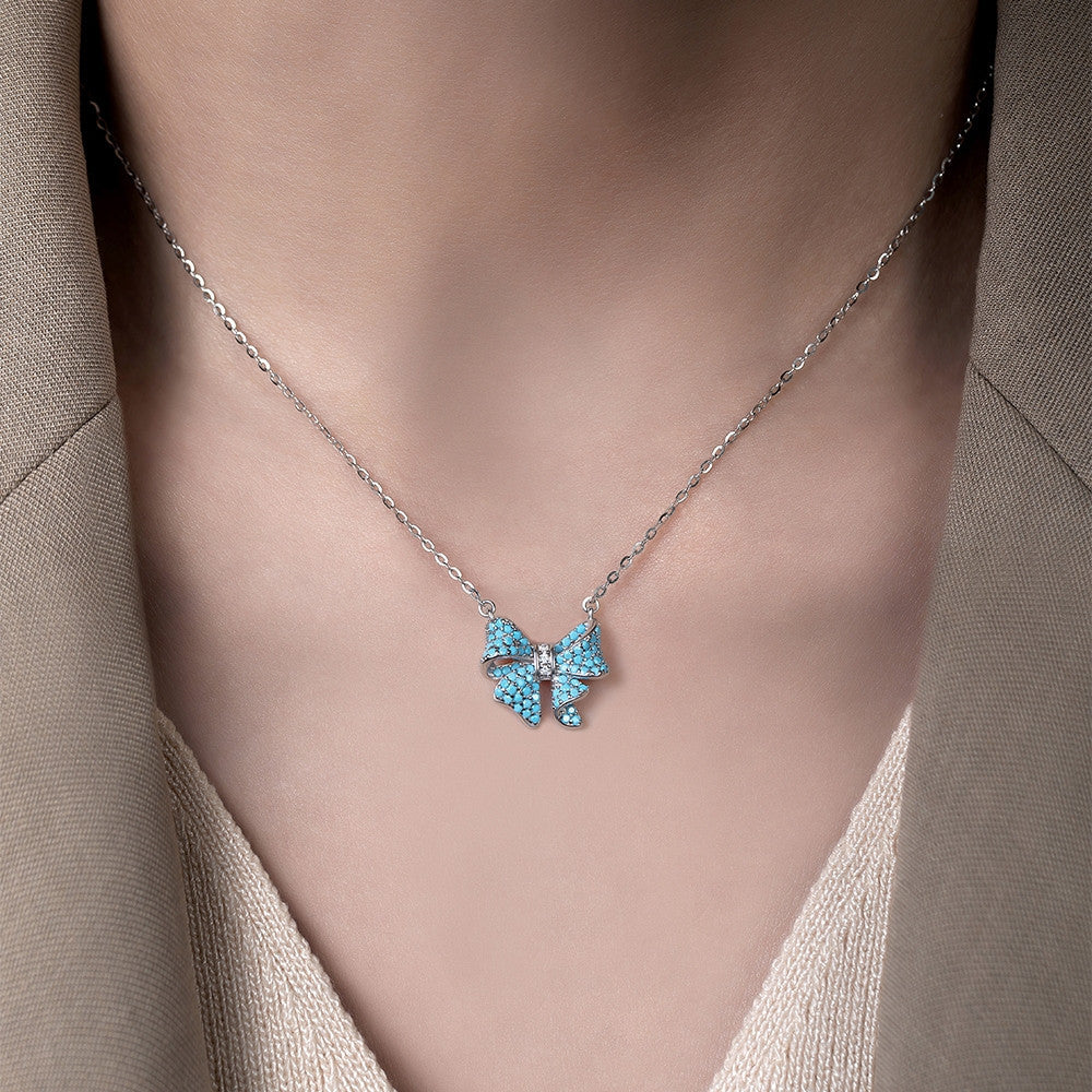 Dây chuyền nơ bạc S925 khảm đá turquoise
