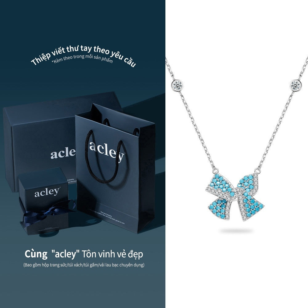 Dây chuyền nơ bạc S925 khảm đá turquoise