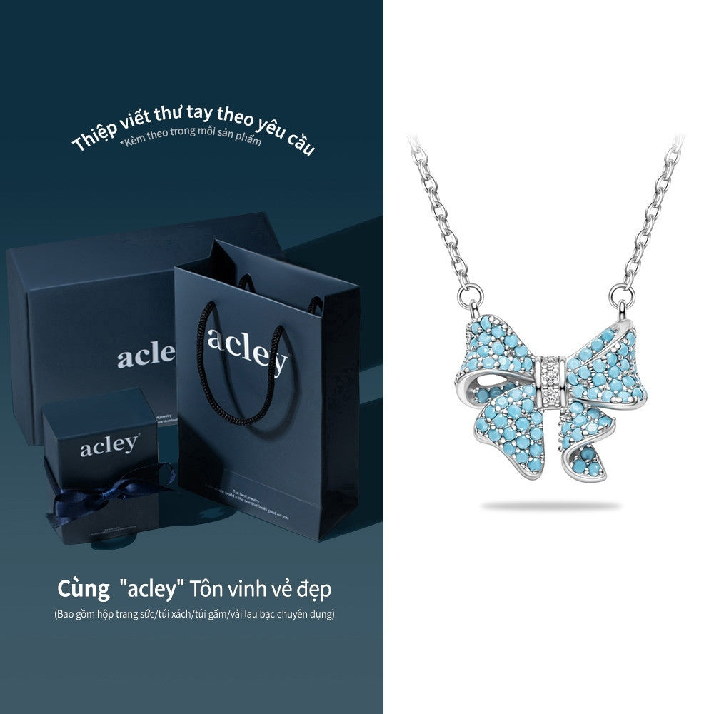 Dây chuyền nơ bạc S925 khảm đá turquoise